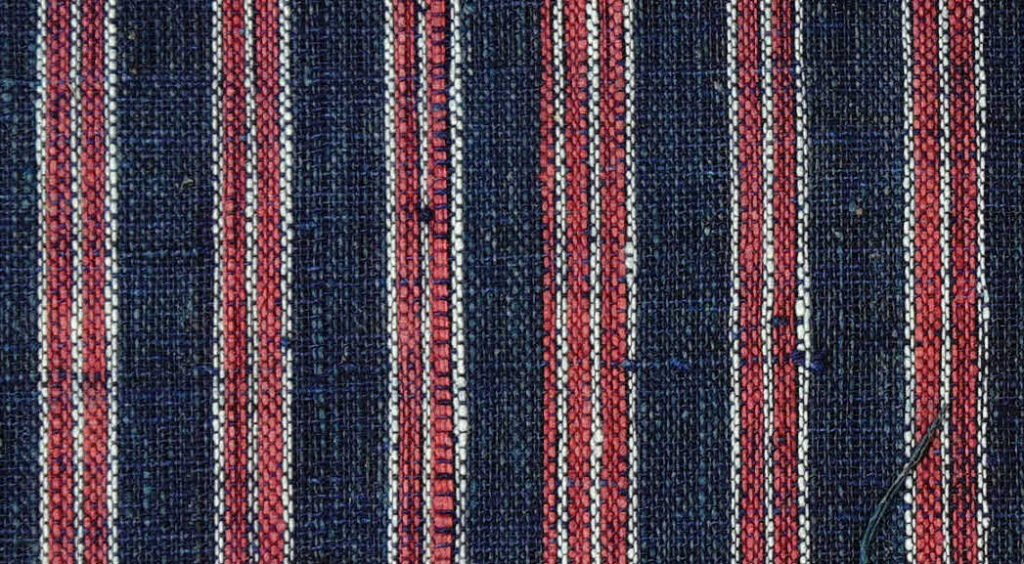 blue cloth with alternating vertical red and white stripes
